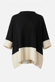 Svart tröja med beige colorblock och ribbade muddar, visad platt framifrån mot vit bakgrund | NEW&CO | Lilla Hem